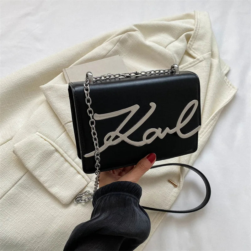 Bolsa tiracolo feminina karl preto modelo