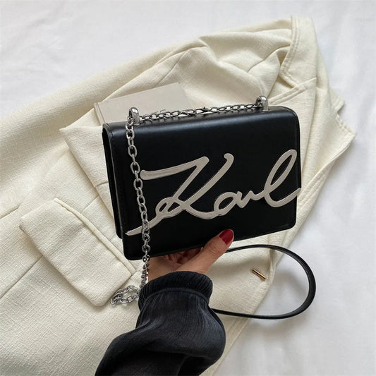 Bolsa tiracolo feminina karl preto modelo